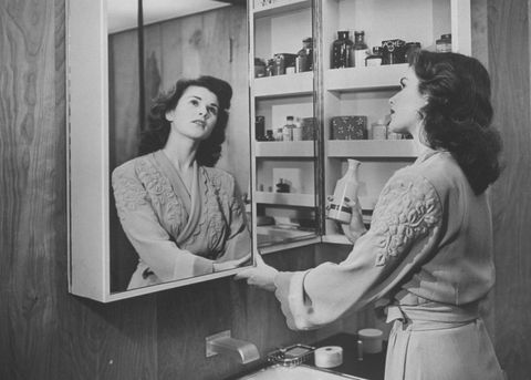 Woman medicine cupboard