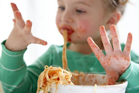 Child eating without knife and fork