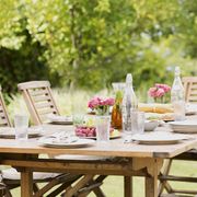 Furniture, Table, Outdoor furniture, Chair, Outdoor table, Linens, Home accessories, Centrepiece, Peach, Sun hat, 