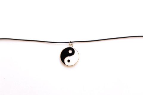 <p>You probably called this symbol "ying yang" by mistake. You probably also wore yours on a cord and made it a choker. </p><p><a href="https://www.etsy.com/listing/234998336/90s-jewelry-grunge-jewelry-choker?ga_order=most_relevant&ga_search_type=all&ga_view_type=gallery&ga_search_query=yin%20yang%20cord%20necklace&ref=sr_gallery_2"><em>Etsy.com</em></a></p>