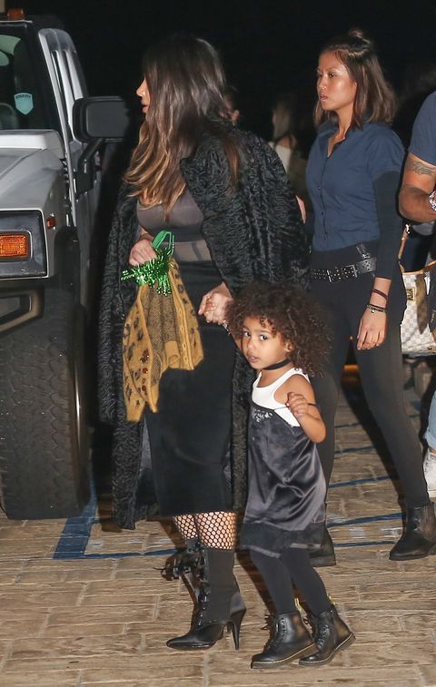 <p>Over the weekend while celebrating her Uncle Rob's birthday, North West was a teeny-tiny punk rocker in a choker, black spaghetti strap dress, tights, and Doc Martens boots.</p>