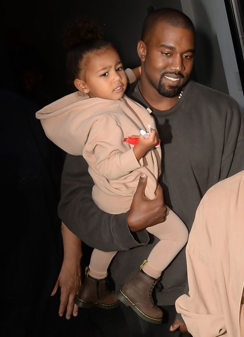 <p>At her dad's Yeezy Season 2 show during New York Fashion Week, North matched the models wearing a pale brown monochrome look in a hoodie, leggings, and leather boots.</p>