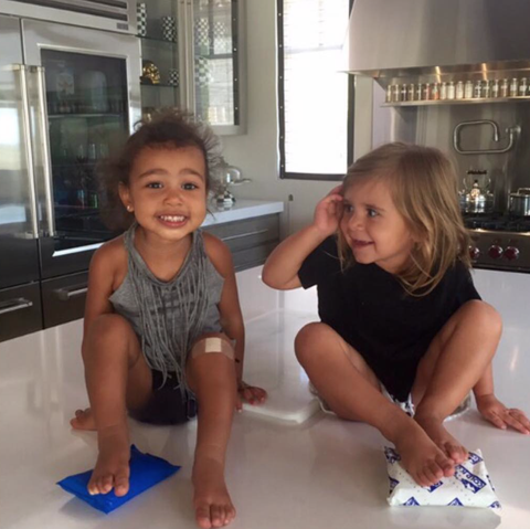 <p>While hanging out with cousin P, North wears a fringed gray tank top and denim shorts.</p>