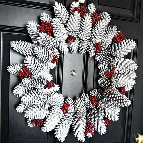 Christmas decoration, Red, Wreath, Interior design, Natural material, Christmas, Silver, Ornament, Creative arts, Floral design, 