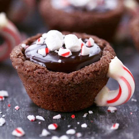 <p>These adorable ganache-filled sugar cookies topped with peppermint will be the star of your party's dessert table.  </p>

<p><strong data-redactor-tag="strong" data-verified="redactor">Get the recipe at <a href="http://www.thegunnysack.com/peppermint-hot-chocolate-cookie-cups/" target="_blank" data-tracking-id="recirc-text-link">The Gunny Sack</a>. </strong></p>