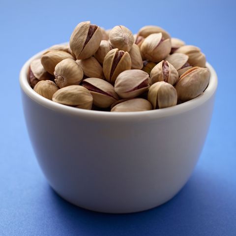 <p>"Pistachios'&nbsp;green and purple hues come from the antioxidant lutein, which is good for your eyes, and&nbsp;they're also a good source of fiber and protein," say Lyssie Lakatos, R.D., and Tammy Lakatos Shames, R.D.,&nbsp;<a href="http://nutritiontwins.com/">The Nutrition Twins</a>. Additionally, they're excellent at helping to prevent snacking overload. "Research shows the shells provide a visual cue [to the eater], which may help curb overeating. That on it's own makes&nbsp;pistachios a true superfood when it comes to mindful snacking and weight management."  <span class="redactor-invisible-space"></span></p><p><span class="redactor-invisible-space"><strong data-verified="redactor" data-redactor-tag="strong">RELATED:&nbsp;<a href="http://www.redbookmag.com/body/healthy-eating/advice/g792/foods-that-burn-belly-fat/" target="_blank" data-tracking-id="recirc-text-link">23 Foods That Fight Belly Fat</a><span class="redactor-invisible-space"><a href="http://www.redbookmag.com/body/healthy-eating/advice/g792/foods-that-burn-belly-fat/"></a></span></strong><br></span></p>