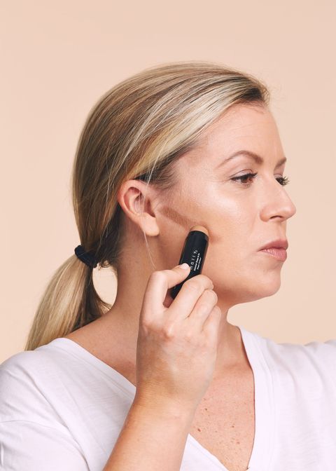 <p>This prevents the bronzer from looking flat. Swipe a shimmer-free cream stick that's one to two shades darker than your skin into the hollows of your cheeks. With a large brush, swirl over the line in circular motions, working up to your hairline.&nbsp;</p><p><strong data-verified="redactor" data-redactor-tag="strong">RELATED:&nbsp;<a href="http://www.redbookmag.com/beauty/makeup-skincare/advice/g761/how-to-contour-with-makeup/" target="_blank" data-tracking-id="recirc-text-link">Contouring for Normal People</a><span class="redactor-invisible-space"><a href="http://www.redbookmag.com/beauty/makeup-skincare/advice/g761/how-to-contour-with-makeup/"></a></span></strong><br></p>
