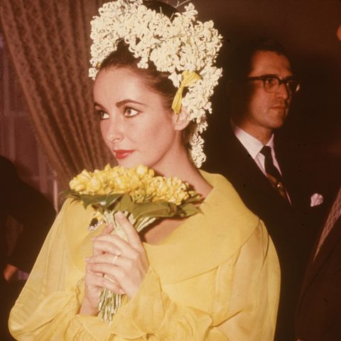 <p>The prolific actress had plenty of chic&nbsp;wedding dresses from her nine marriages, but her most distinctive look&nbsp;was from her fifth &nbsp;– <a href="http://www.goodhousekeeping.com/beauty/fashion/g1550/elizabeth-taylor-wedding-dresses/?slide=1" target="_blank" data-tracking-id="recirc-text-link">the yellow chiffon gown and flower headdress</a> that she wore for her first weddings to <a href="http://www.redbookmag.com/love-sex/relationships/g2188/on-set-romances/" target="_blank" data-tracking-id="recirc-text-link">her two-time husband and&nbsp;<em data-redactor-tag="em" data-verified="redactor">Cleopatra</em>&nbsp;co-star&nbsp;Richard Burton</a> in 1964.</p>