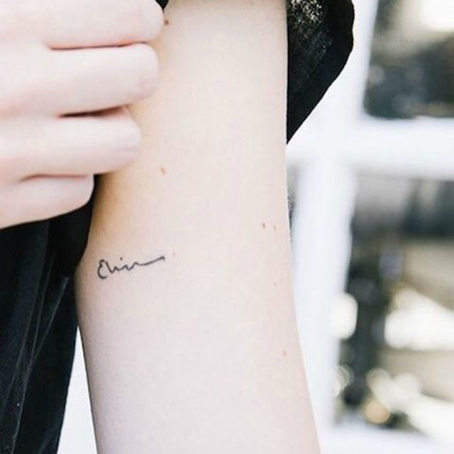 delicate word tattoos