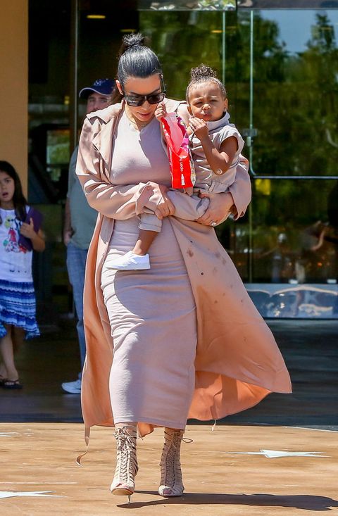 <p>When there aren't napkins around, <a href="http://www.redbookmag.com/life/news/a38560/north-west-kim-kardashian-lanvin-coat/ " target="_blank" data-tracking-id="recirc-text-link">you have to be resourceful</a>. No one wants sticky hands.&nbsp;</p>
