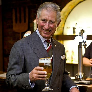 prince charles drinking a pint of beer