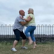 Human, Human body, Mammal, People in nature, Interaction, Knee, Love, Gesture, Fence, Romance, 