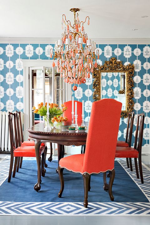 <p><strong data-redactor-tag="strong" data-verified="redactor">1. Go big with pattern.&nbsp;</strong><span>The room is small, but that didn't stop Mazzarini from using bold blue-and-white, pagoda-printed wallpaper. "The repetition <a href="http://www.redbookmag.com/home/decor/tips/g2358/decor-hacks/" target="_blank" data-tracking-id="recirc-text-link">makes the space seem larger</a>," he says.</span></p><p><strong data-redactor-tag="strong" data-verified="redactor">2. Rehab what you have.&nbsp;</strong><span>To really modernize the homeowner's existing dining set, Mazzarini covered the side chairs in a fun coated orange leather — the glossy finish wipes right up. (Vinyl is good too.) Paired with newly reupholstered end chairs, the result is fresh.</span></p><p><strong data-redactor-tag="strong" data-verified="redactor">3. Spruce up the wood.&nbsp;</strong><span>Over time, the table had become parched and drab. Some elbow grease and a little </span><span>Murphy Oil Soap brought back its original shine.</span></p><p><strong data-redactor-tag="strong" data-verified="redactor">4. Scour the web.&nbsp;</strong><span>That <a href="http://www.redbookmag.com/home/decor/g3032/home-decorating-hacks/" target="_blank" data-tracking-id="recirc-text-link">awesome mirror</a> on the wall? It was scored on eBay and only looks like it costs — and weighs — a ton. (It's made of lightweight fiberglass.) To find a similar style among all the options online, Mazzarini suggests searching resale sites with the term "Hollywood Regency."</span></p>