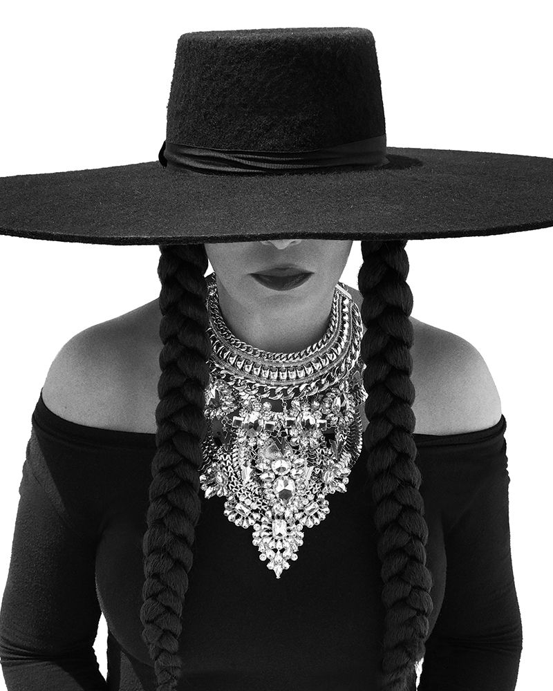 Black, Clothing, Hat, Fashion accessory, Headgear, Black-and-white, Necklace, Sun hat, Costume accessory, Neck, 