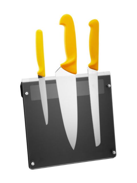 knives with yellow handles on magnetic rack