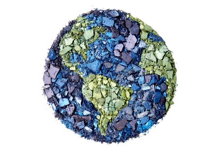 a globe made from crushed purple blue and green eyeshadow