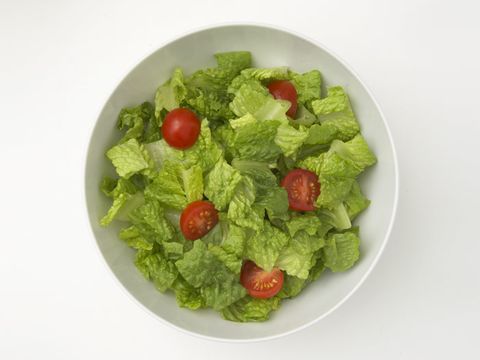 green salad in bowl with cherry tomatoes