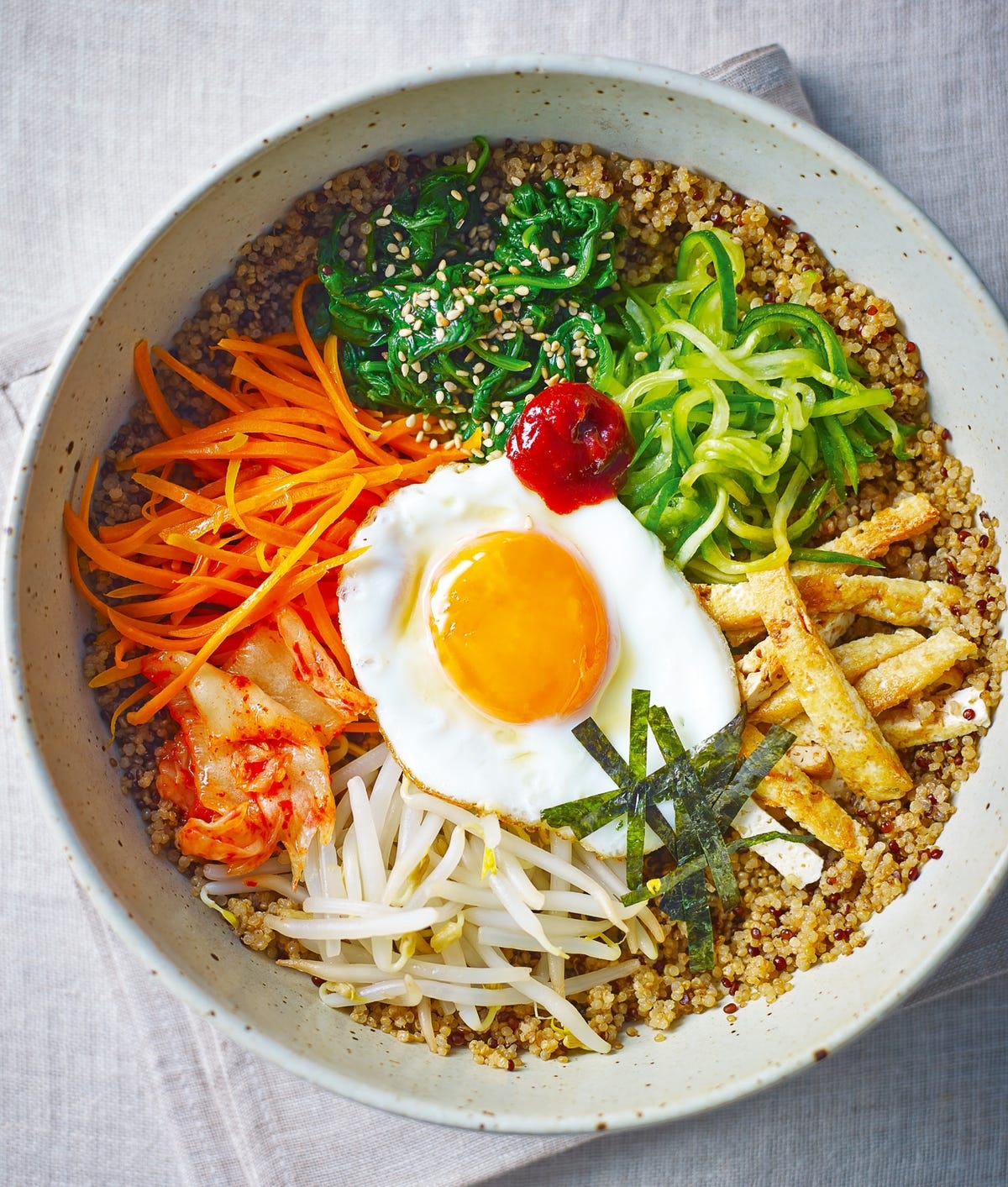 https://hips.hearstapps.com/redonline/main/thumbs/18377/p154-nutritious-vegetarian-korean-bibimbap-quinoa.jpg?crop=1xw:0.805241935483871xh;center,top&resize=1200:*