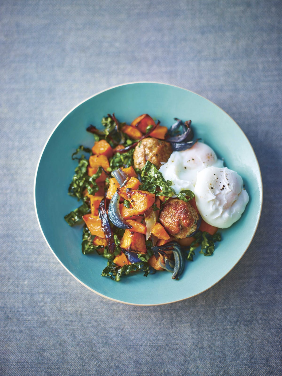 image of Lorraine Pascale's Sweet Potato, Cavolo Nero and Rosemary Meatball Hash With Poached Eggs recipe by Red Online