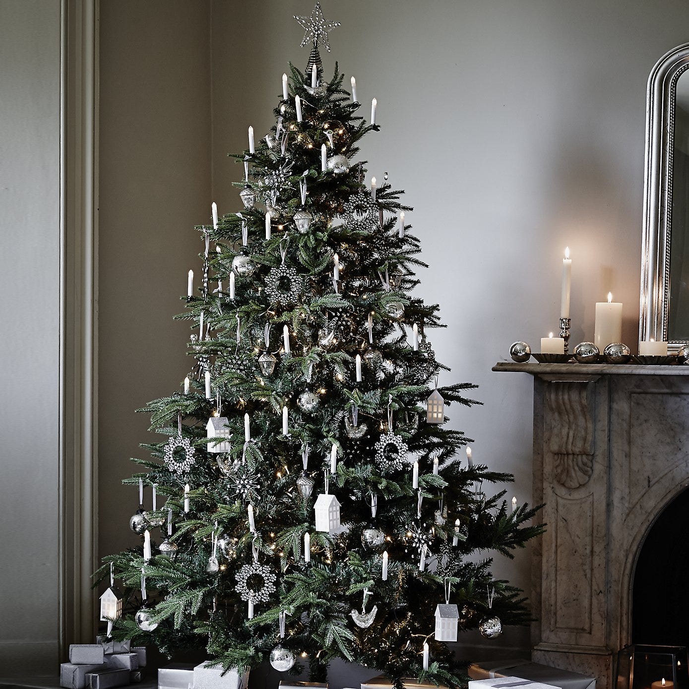 white christmas tree with silver and red decorations