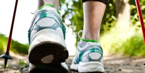 Green, Footwear, Walking, Human leg, Shoe, Leg, Trail, Nordic walking, Ankle, Joint, 