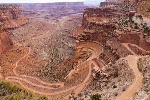 White Rim Trail Canyonlands National Park <p>We end our list at one of the most scenic routes: the White Rim Trail on the edge of Island in the Sky Mesa in Canyonlands National Park. Set aside two days to run the 100-mile White Rim Trail, and along the way you'll witness Utah's famous sandstone arches, as well as towers, buttes, Indian ruins, and views of the Colorado and Green rivers. Campsites along the Trail book up early and often, so plan ahead. And, as is the case with all other desert destinations, bring at least one gallon of water per person per day. It also bears mentioning that if you're feeling especially ambitious, the White Rim can be travelled by mountain bike, too. </p>