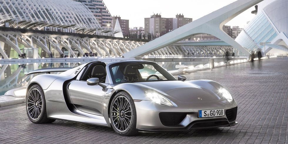 With 608 gas-powered bhp turning the rear wheels and 279 electric bhp turning the front, the 918 Spyder is a four-wheel-drive 887 bhp supercar. The electric motor has a range of 12 miles and can be charged via engine power, regenerative braking, or charging station.