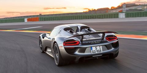 <p>The 918 Spyder has what Porsche calls "top pipes" or <a href="http://www.roadandtrack.com/new-cars/road-tests/reviews/a6185/8-more-things-porsche-918/">top-exit exhaust pipes</a>. <a href="http://flatsixes.com/cars/porsche-918-spyder-cars/porsches-918-spyder-exhaust-exit-top-pipes/" target="_blank">These help the 918</a> save weight (because there's less actual pipe used) and reduce back pressure. The 918's engine is derived from <a href="http://www.roadandtrack.com/motorsports/videos/a26880/take-a-ride/">the RS Spyder race car</a> so that's why it sounds more race car than road car.</p>