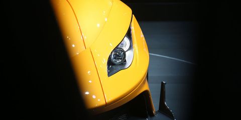 Motor vehicle, Automotive design, Yellow, Automotive lighting, Headlamp, Automotive exterior, Automotive mirror, Automotive parking light, Fender, Amber, 