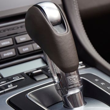 Motor vehicle, Automotive design, Luxury vehicle, Logo, Personal luxury car, Steering wheel, Steering part, Center console, Gear shift, Carbon, motor vehicle, automotive design, luxury vehicle, logo, personal luxury car, steering wheel, steering part, center console, gear shift, carbon,