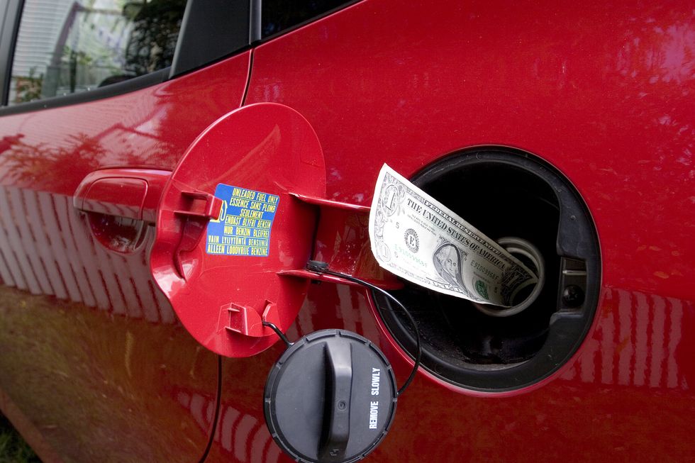 money going into a gas tank