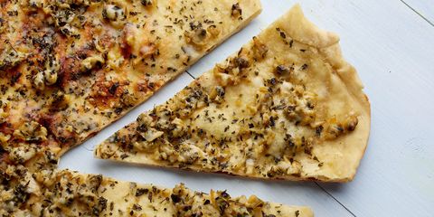 <p>Just down the road from New York's thin-crust slices, pizza New Haven developed its own permutation. New Haven-style is a pizza with a thin hand-tossed crust, charred to a crisp in coal ovens, sporting few toppings. Clam is one of those, incidentally.</p>