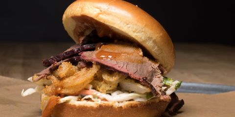 <p>It's the Z-Man! A barbecue sandwich named after a sports talk radio host, it's thin-sliced brisket, melted provolone cheese, and crispy onion rings.</p>