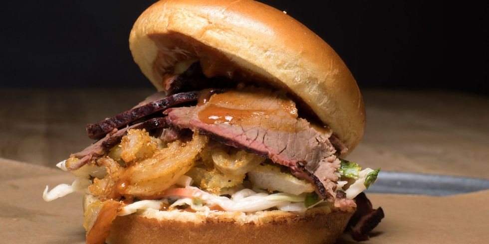 <p>It's the Z-Man! A barbecue sandwich named after a sports talk radio host, it's thin-sliced brisket, melted provolone cheese, and crispy onion rings.</p>