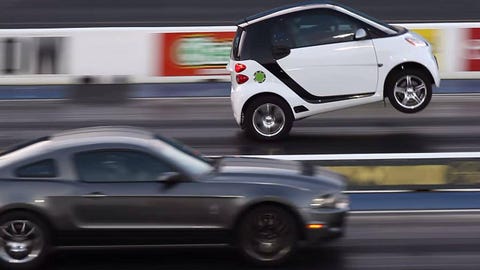 It's Smart vs. Mustang, and you won't guess which one wheelstands