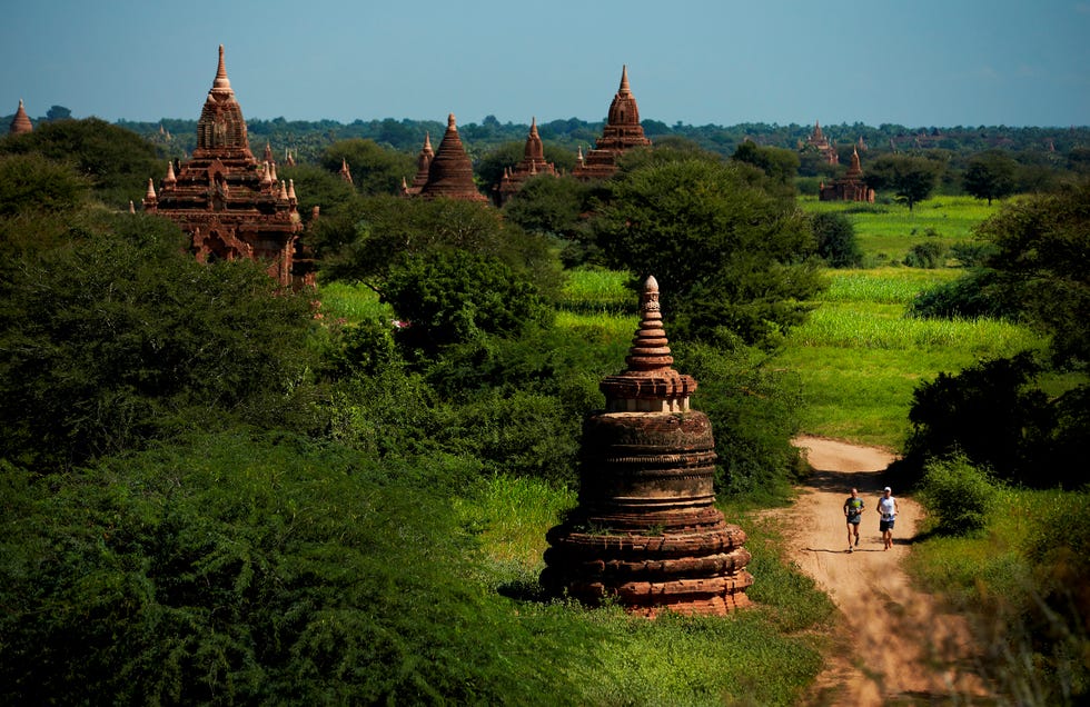 Pagoda, Vegetation, Sky, Landmark, Historic site, Temple, Place of worship, Spire, Grass, Tower, 