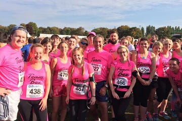 People, Social group, Pink, Community, Magenta, Team, Sleeveless shirt, Active shorts, Endurance sports, Active tank, 
