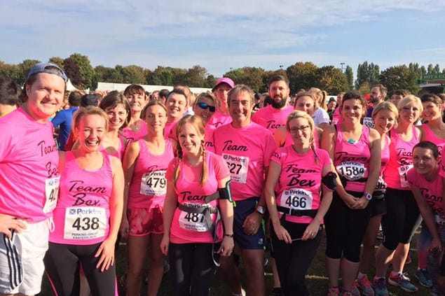 People, Social group, Pink, Community, Magenta, Team, Sleeveless shirt, Active shorts, Endurance sports, Active tank, 