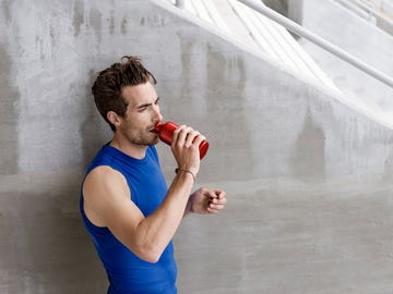 Elbow, Hand, Sleeveless shirt, Wrist, Drinking, Chest, Active tank, Thumb, Abdomen, Undershirt, 