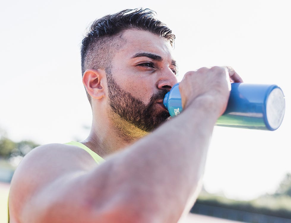 Facial hair, Water, Nose, Arm, Chin, Drinking, Beard, Muscle, Barechested, Mouth, 