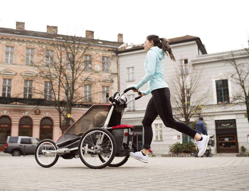 How does pushing a child in a running buggy affect my running form