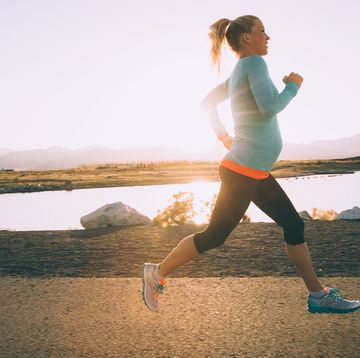 pregnant woman running with support band