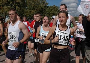 People, Social group, Recreation, Sports uniform, Endurance sports, Quadrathlon, Sleeveless shirt, Crowd, Community, Athlete, 