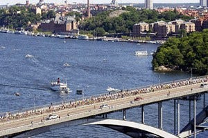 Body of water, Water, Photograph, Waterway, Bridge, City, Fixed link, Urban area, Beam bridge, Metropolitan area, 