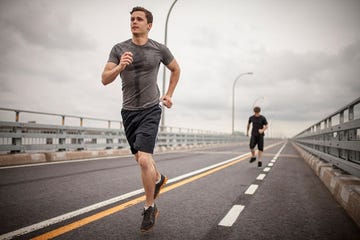 Leg, Road, Recreation, Human leg, Infrastructure, Asphalt, Standing, Running, Active shorts, Outdoor recreation, 