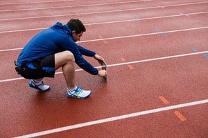 Blue, Leg, Human leg, Shoe, Athletic shoe, Track and field athletics, Elbow, Joint, Standing, Sportswear, 