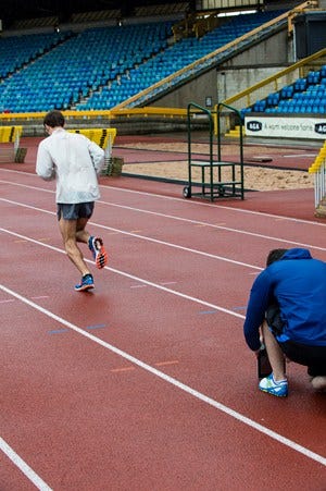Blue, Sport venue, Track and field athletics, Athletic shoe, Stadium, Line, Sports, Running, Active shorts, Athlete, 