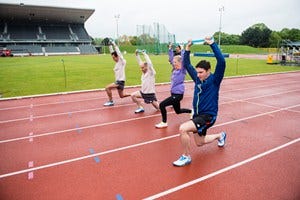 People, Athletic shoe, Sport venue, Leisure, Community, Line, Shorts, Track and field athletics, Sports, Knee, 