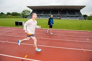 Leg, Grass, Daytime, Sport venue, Infrastructure, Standing, Photograph, Public space, White, Leisure, 