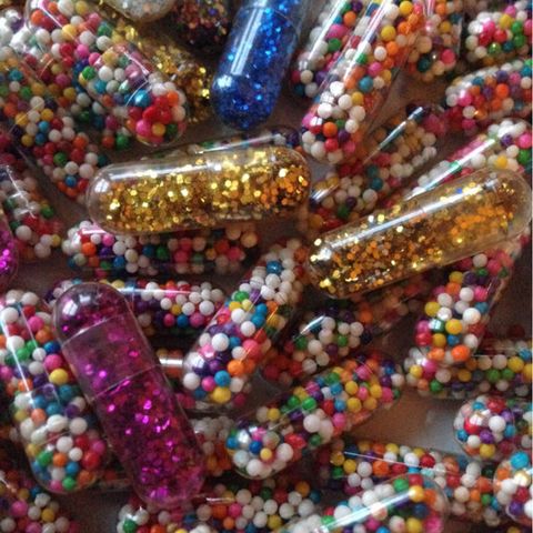Blue, Brown, Pink, Natural material, Amber, Fashion accessory, Bead, Art, Colorfulness, Creative arts, 